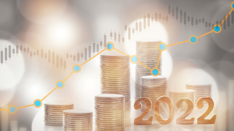 Stacks of coins and graph lines with the number 2022 to indicate the year