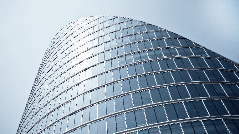 A skyscraper covered in glass