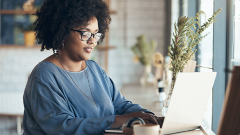 A woman on her computer.