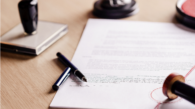 Notary pen lying on testament